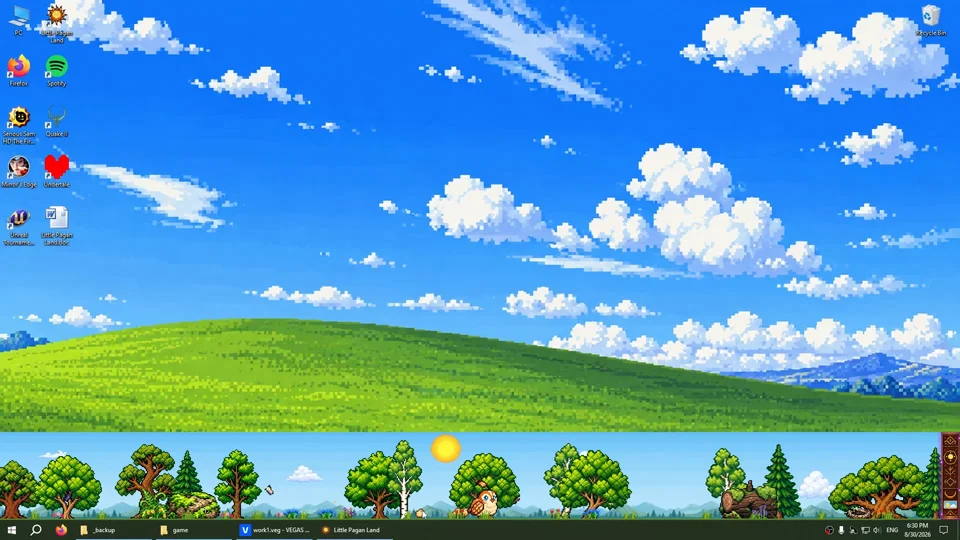 Little Pagan Land with the background on: above the taskbar, the forest runs across the screen in its own band of sky and hills, under a Windows desktop wallpaper.